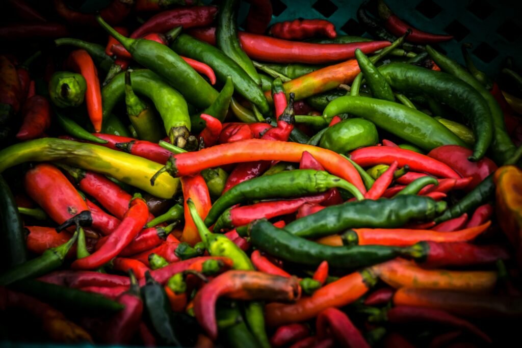 Colorful mix of fresh chili peppers highlighting their natural vibrancy and variety.